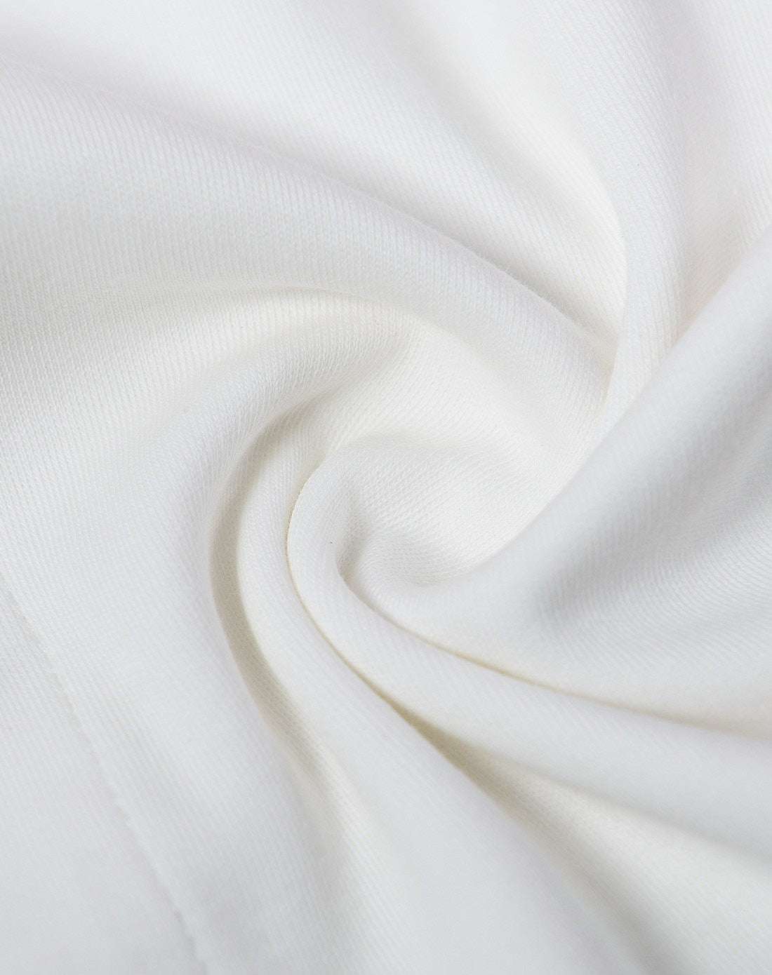 Close-up of white fabric with a soft texture and 100% cotton
