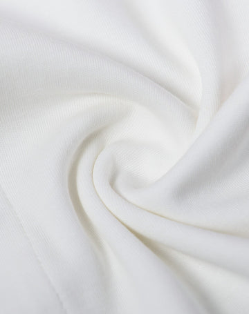 Close-up of white fabric with a soft texture and 100% cotton